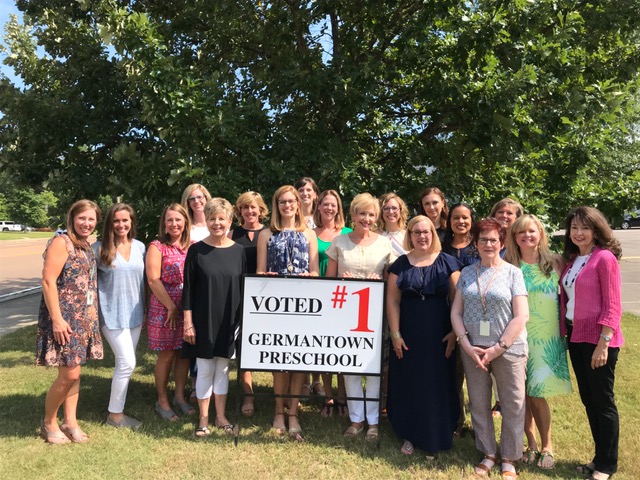 school staff with #1 sign